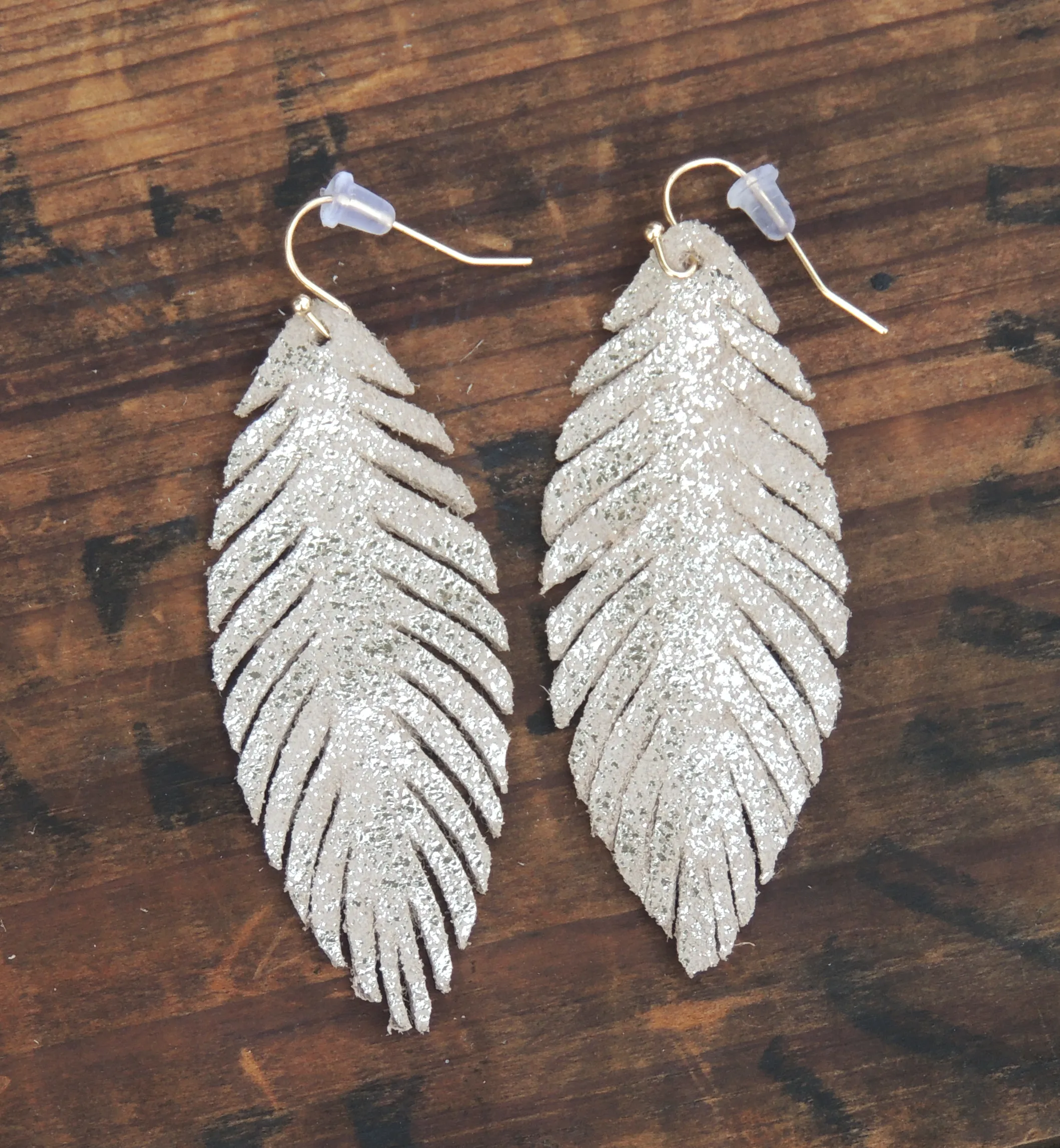 Gold feather earrings